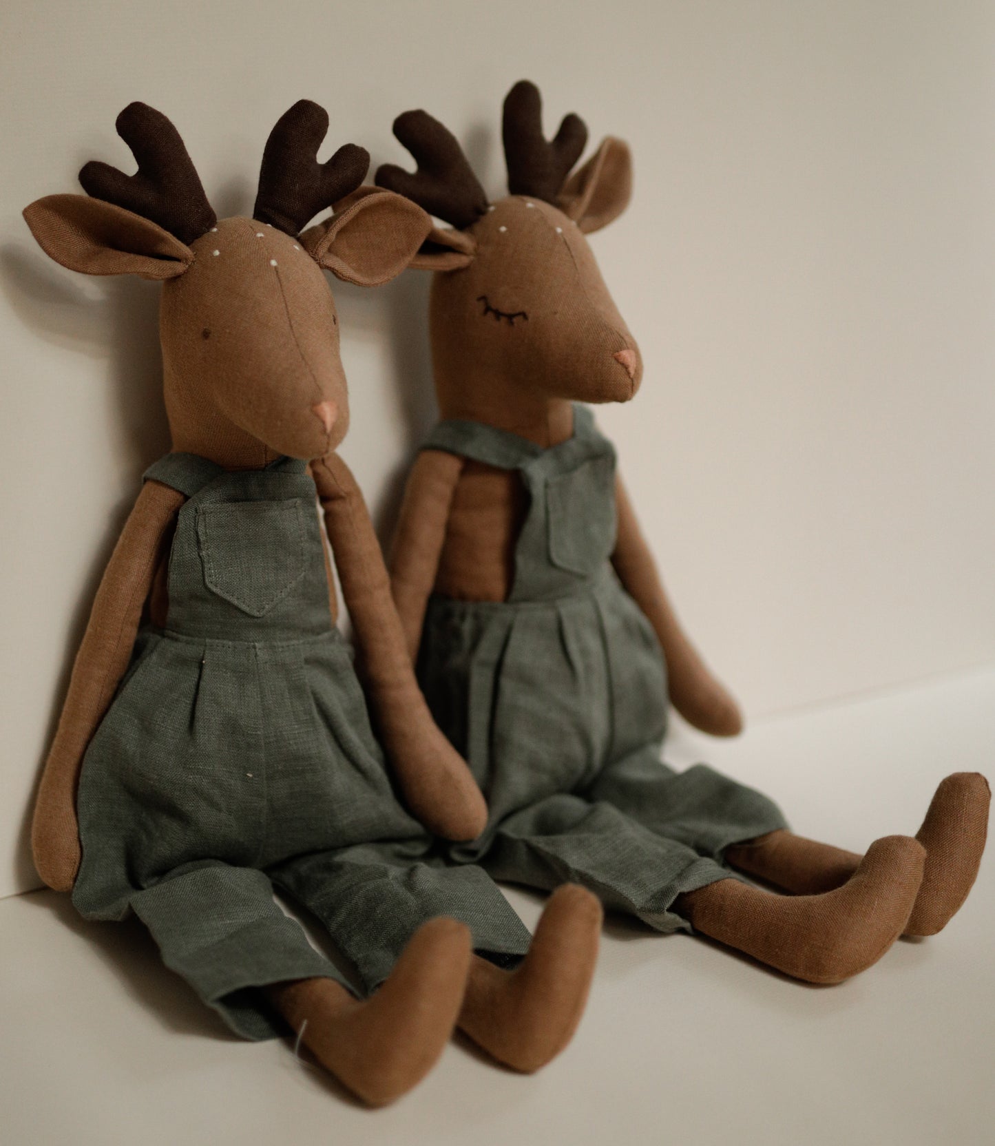 Deer toy 55 cm in green linen dungarees with antlers