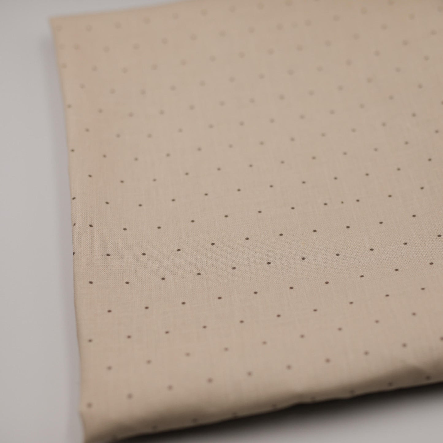 Tiny polka dot on subtle sand 100% linen fabric