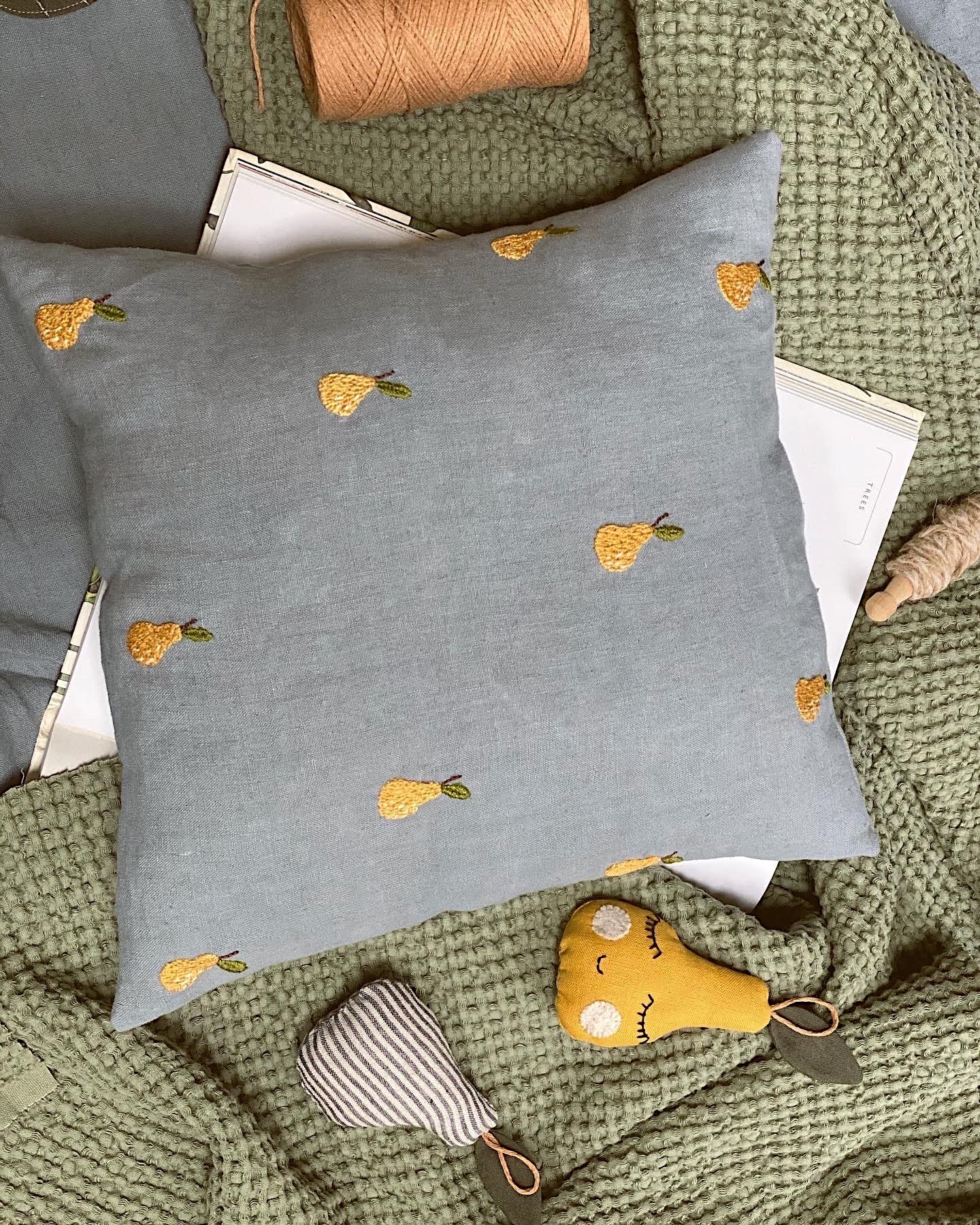 Linen cushion cover with hand embroidered tiny pears
