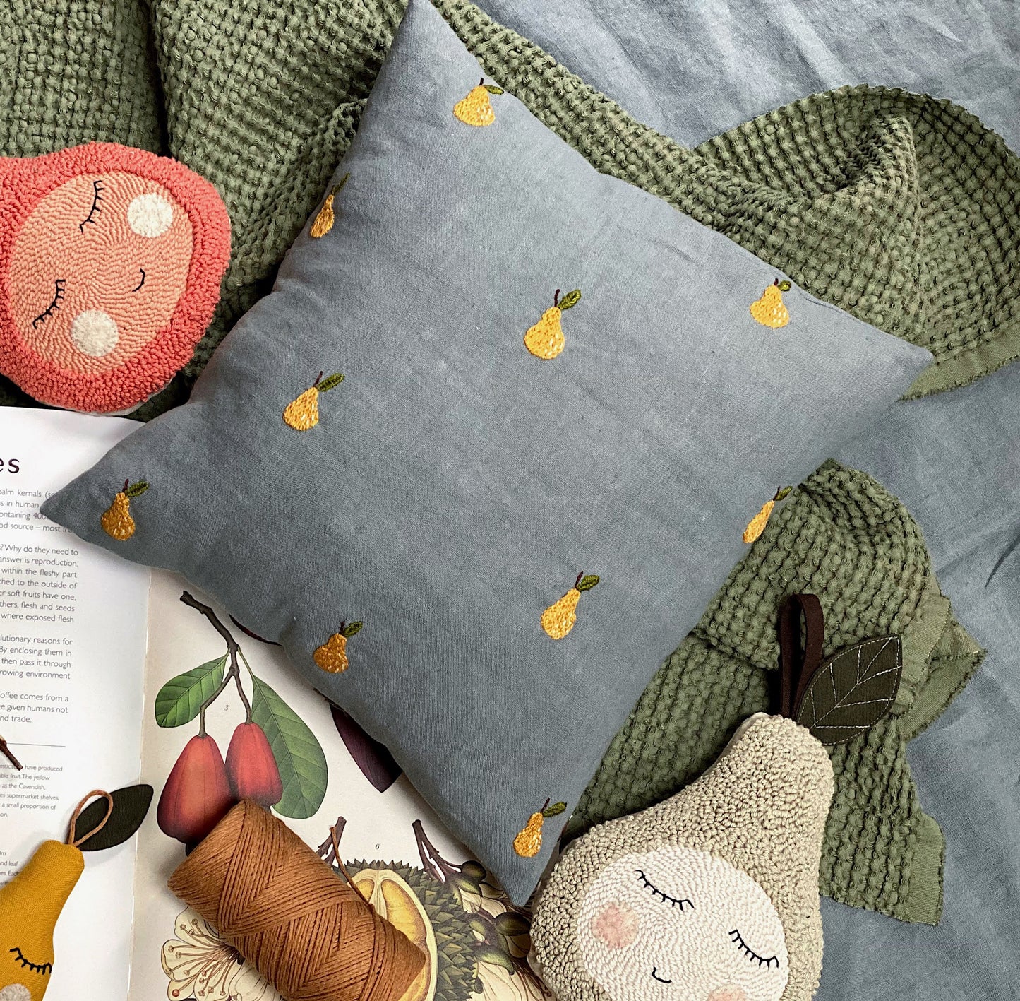 Linen cushion cover with hand embroidered tiny pears