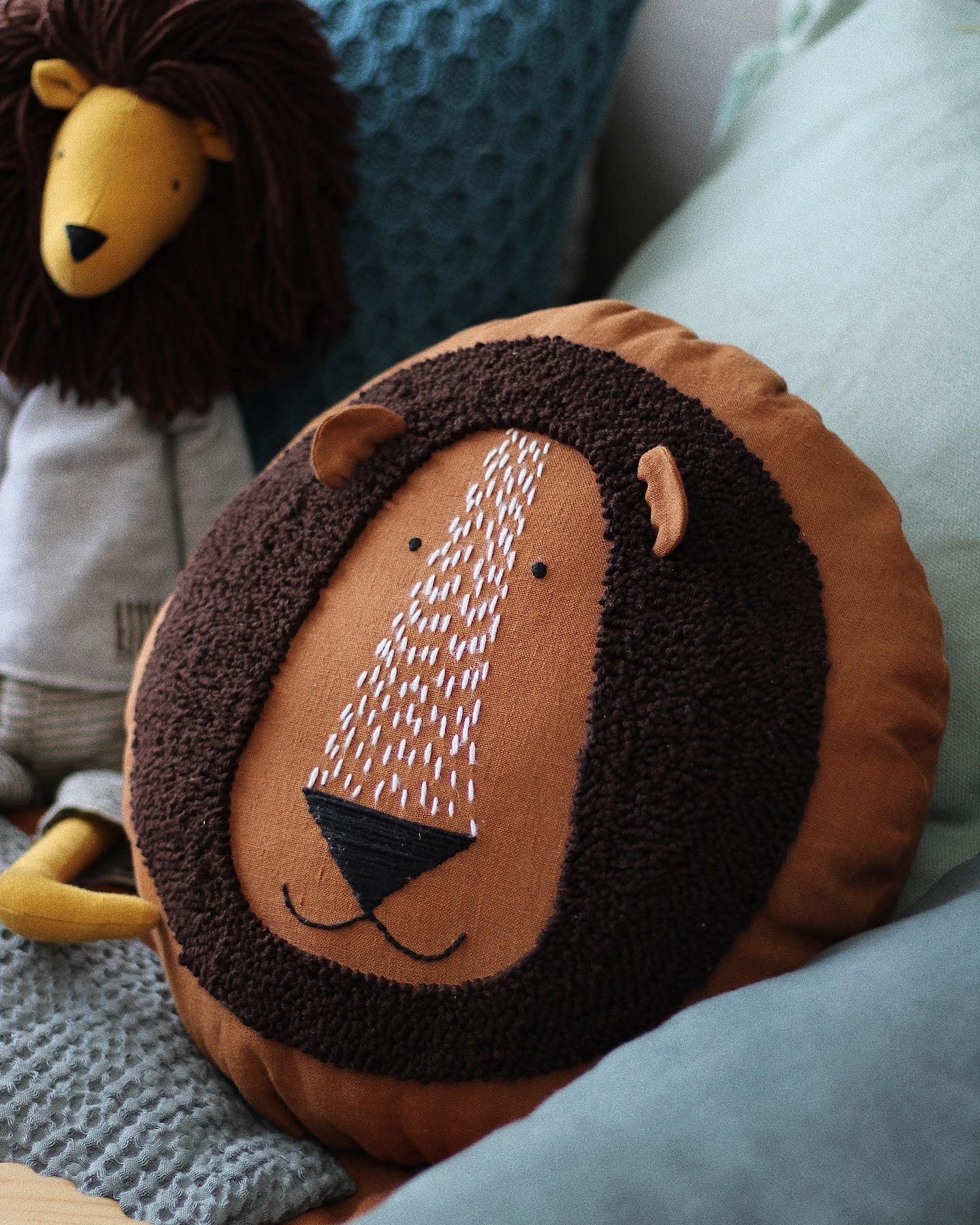 Lion cushion in rust colour
